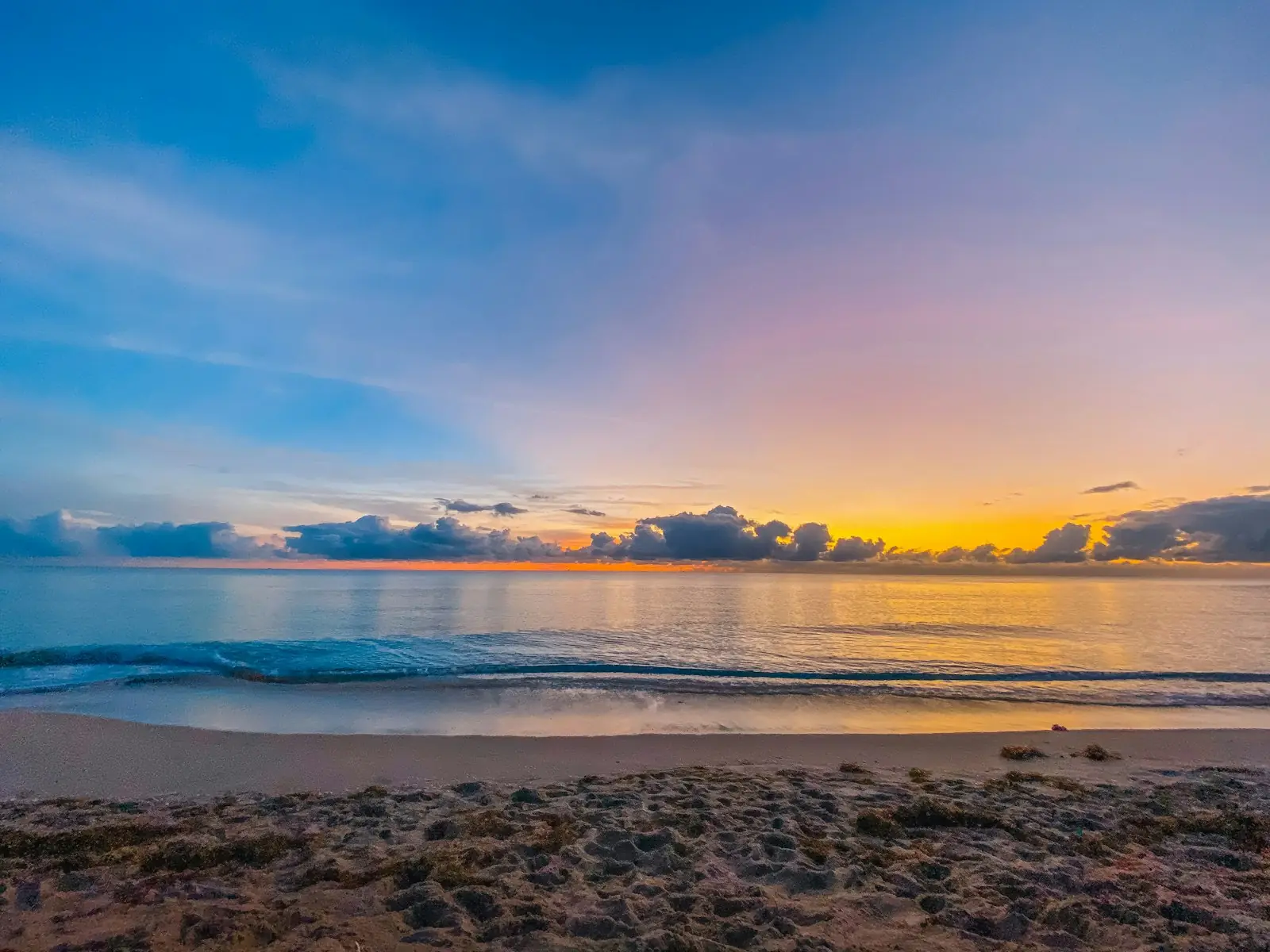 Soft pink and orange light over the ocean at dusk
